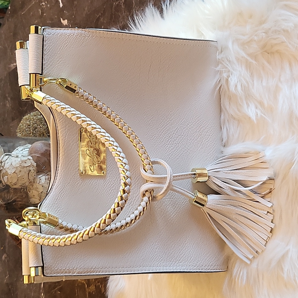 White Carolyn Tucker purse with woven handles and tassels, great condition NWOT